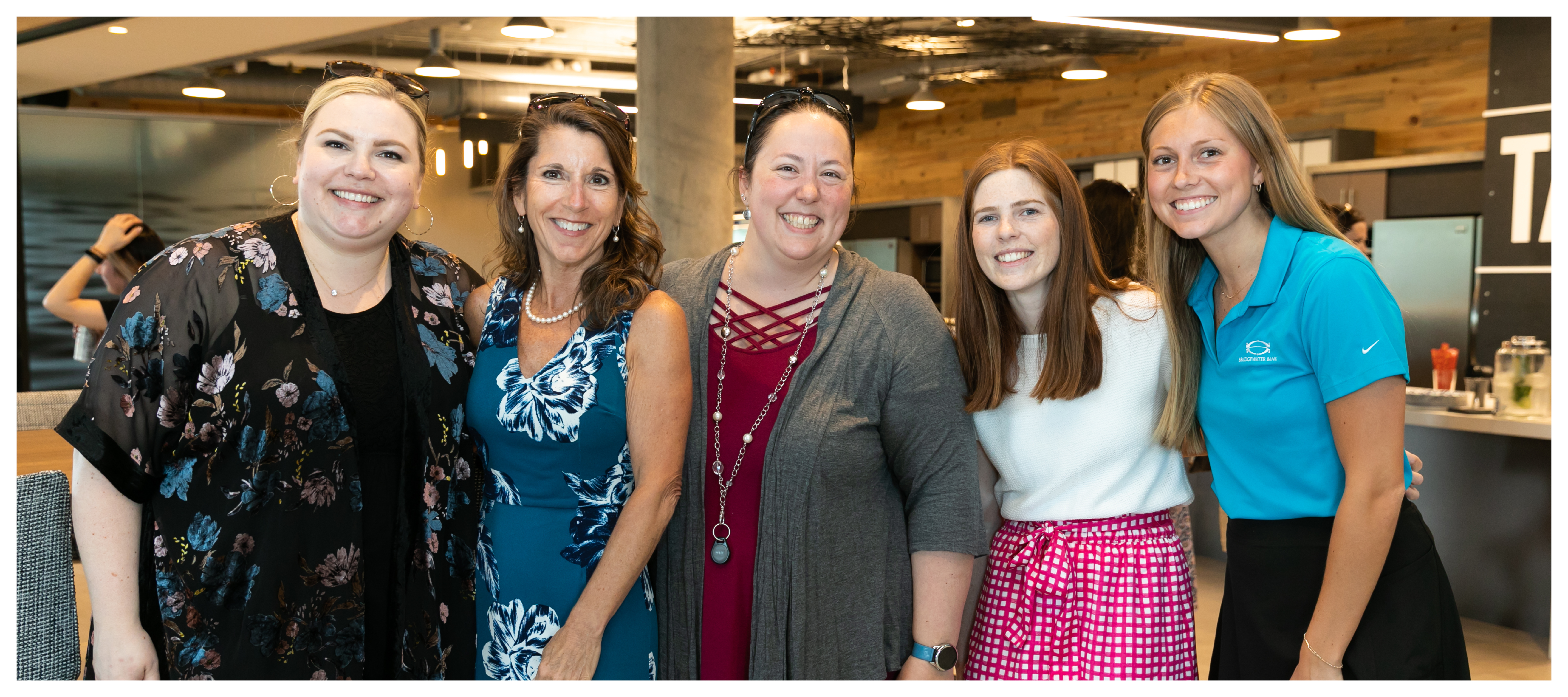 Group photo of PrimeTrust Group women at an internal happy hour.