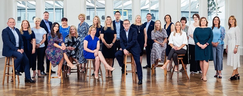 Photo of PrimeTrust Group team celebrating.